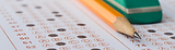 Exam answer sheet with pencil and eraser