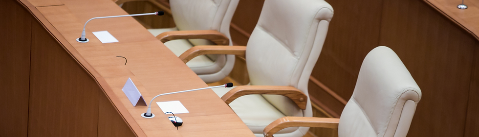 A long table and a row of chairs.