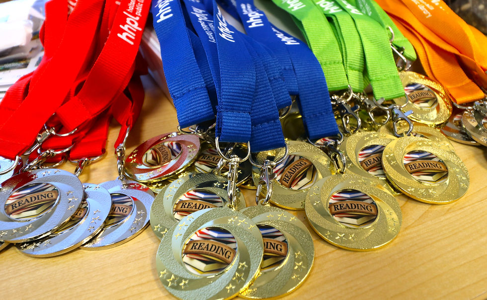 Gold and silver Battle of the Books medals with colorful lanyards