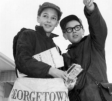 Georgetown newspaper boy and a friend pointing