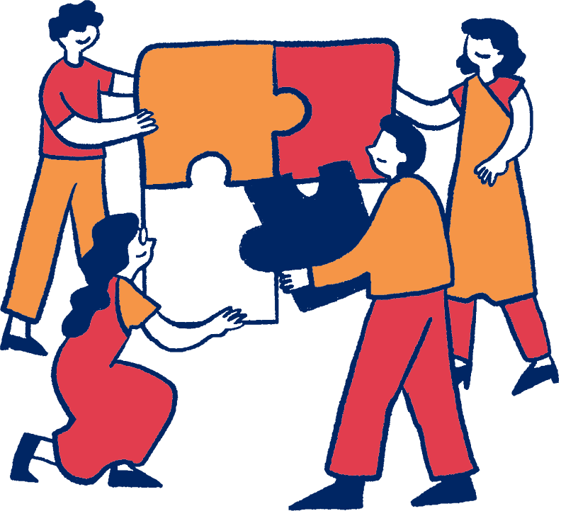 Four people collaborating to assemble giant puzzle pieces.