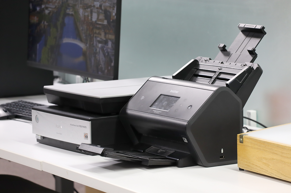 Two scanners sitting on a desk.