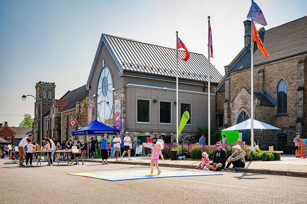 Families and children outside the library.