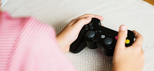 Hands holding a video game controller