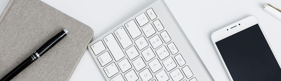 An image of a pen, folder, keyboard and smartphone.