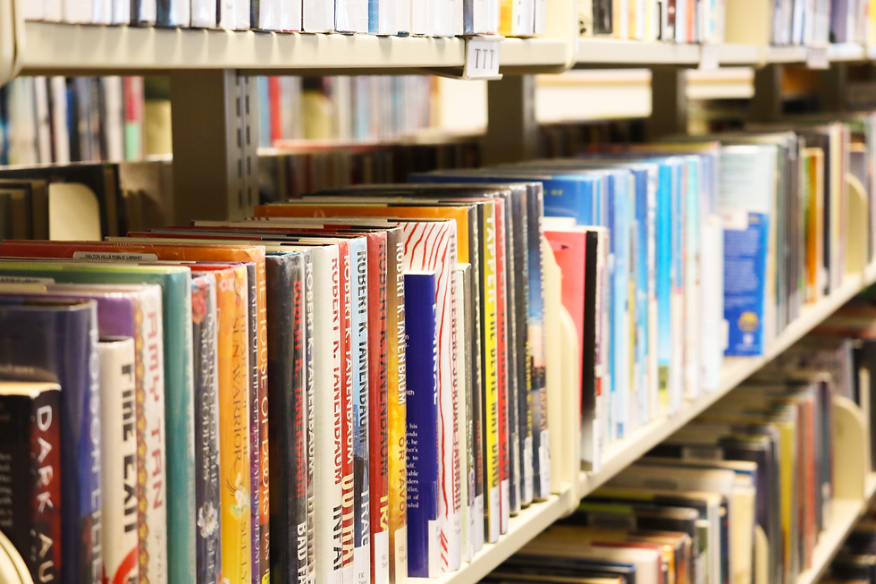 Books lined up on shelves in a library.